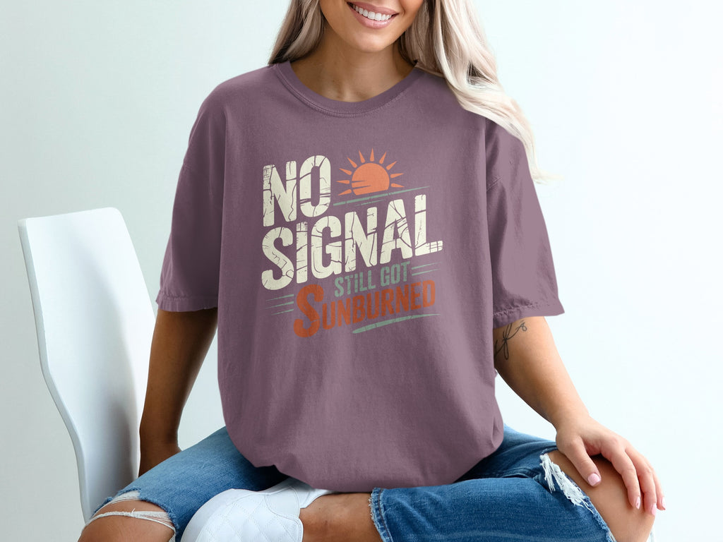 Purple t-shirt with "NO SIGNAL STILL GOT SUNBURNED" text and a sun graphic.