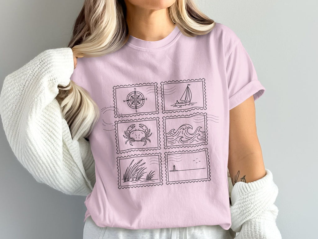 Pink t-shirt with six square maritime-themed stamp illustrations.