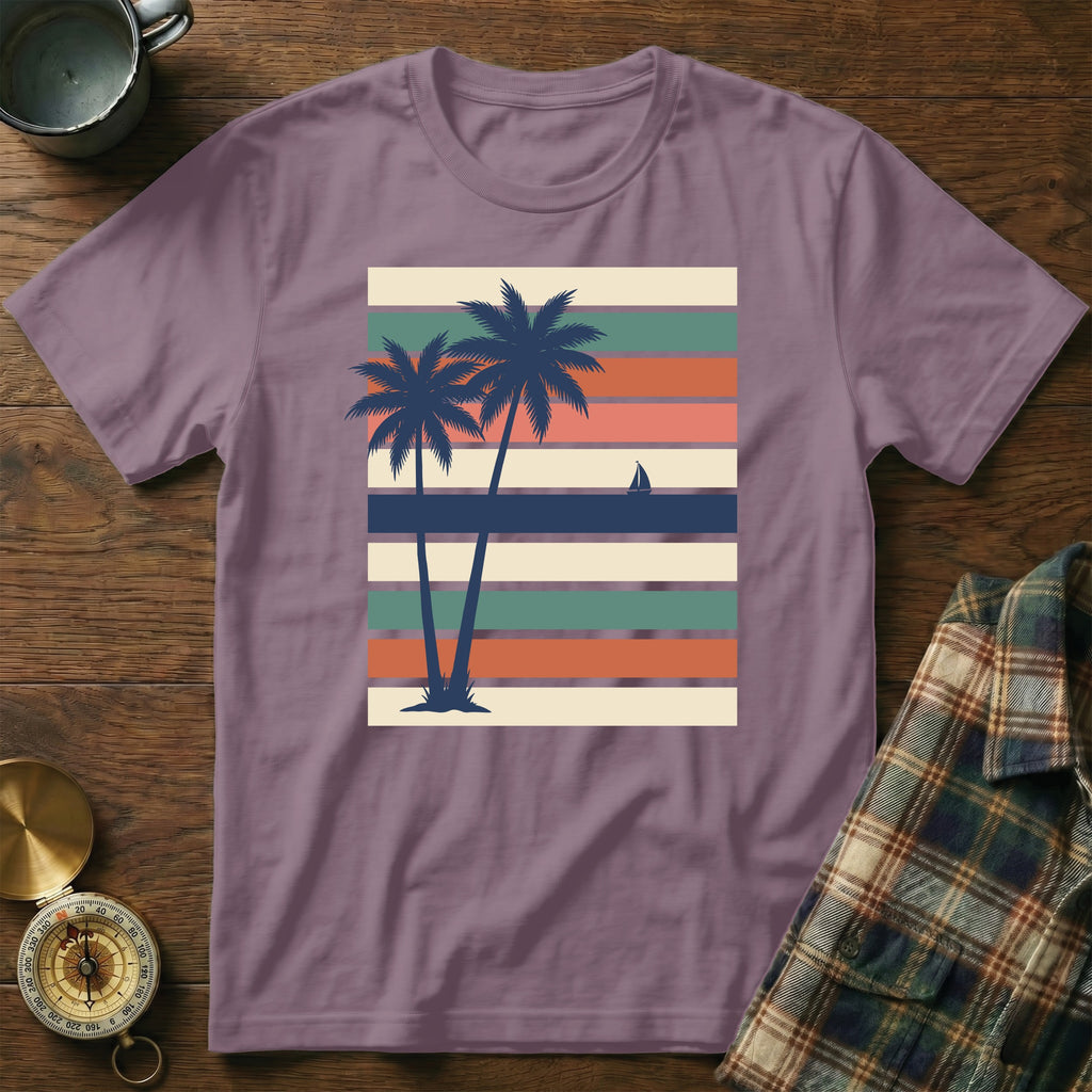 T-shirt with palm trees, sailboat, and striped background.