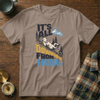 Taupe crewneck t-shirt featuring a mountain goat sliding down a hill with the text It's All Downhill From Here.