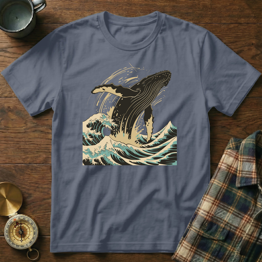 T-shirt with a graphic of a whale breaching in stylized ocean waves.