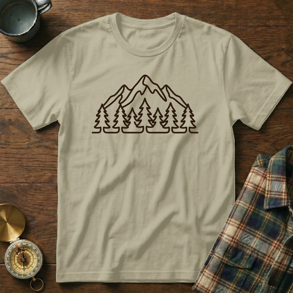 Beige t-shirt with dark brown outline graphic of mountains and pine trees.