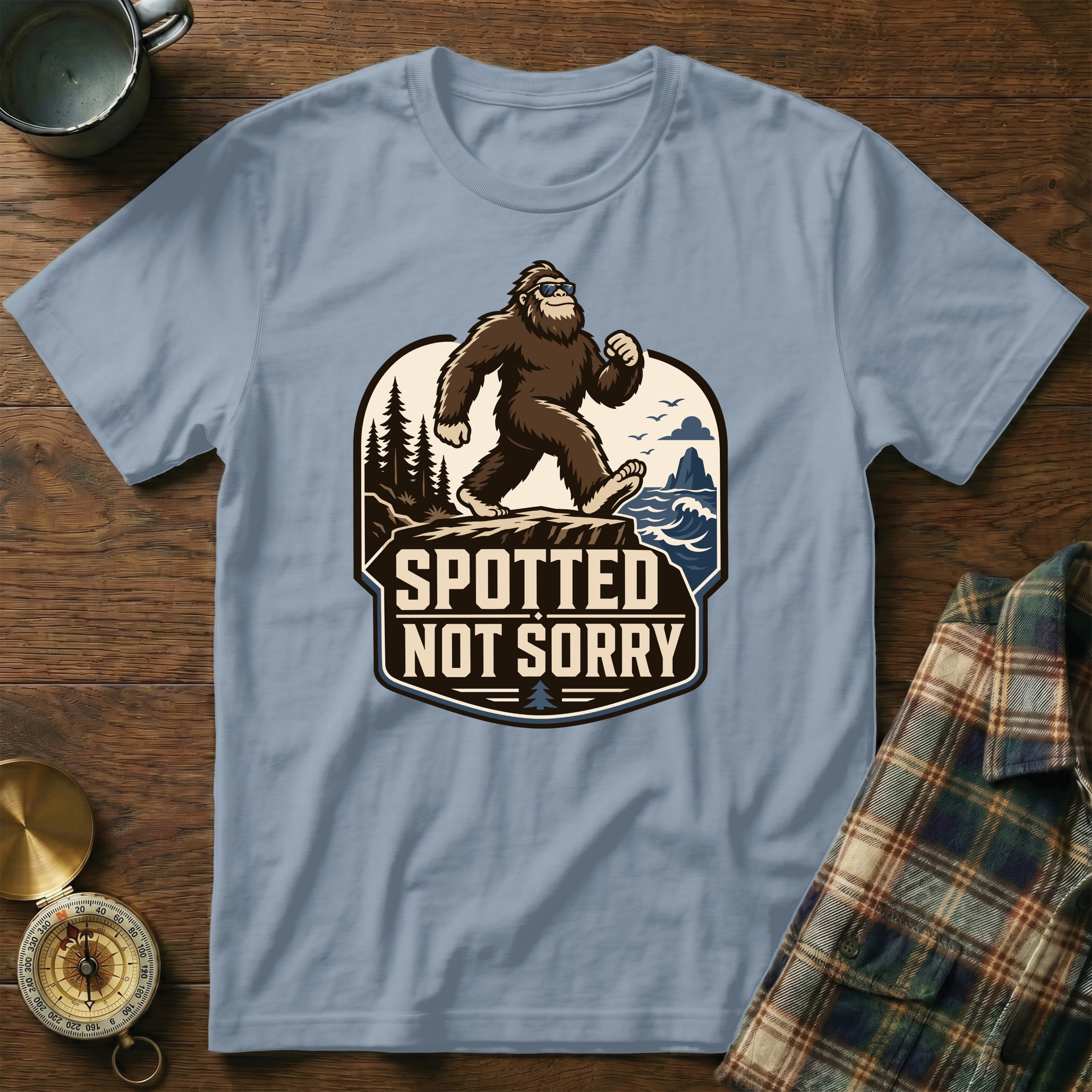 Bigfoot with sunglasses walking on a cliff, text "SPOTTED NOT SORRY".