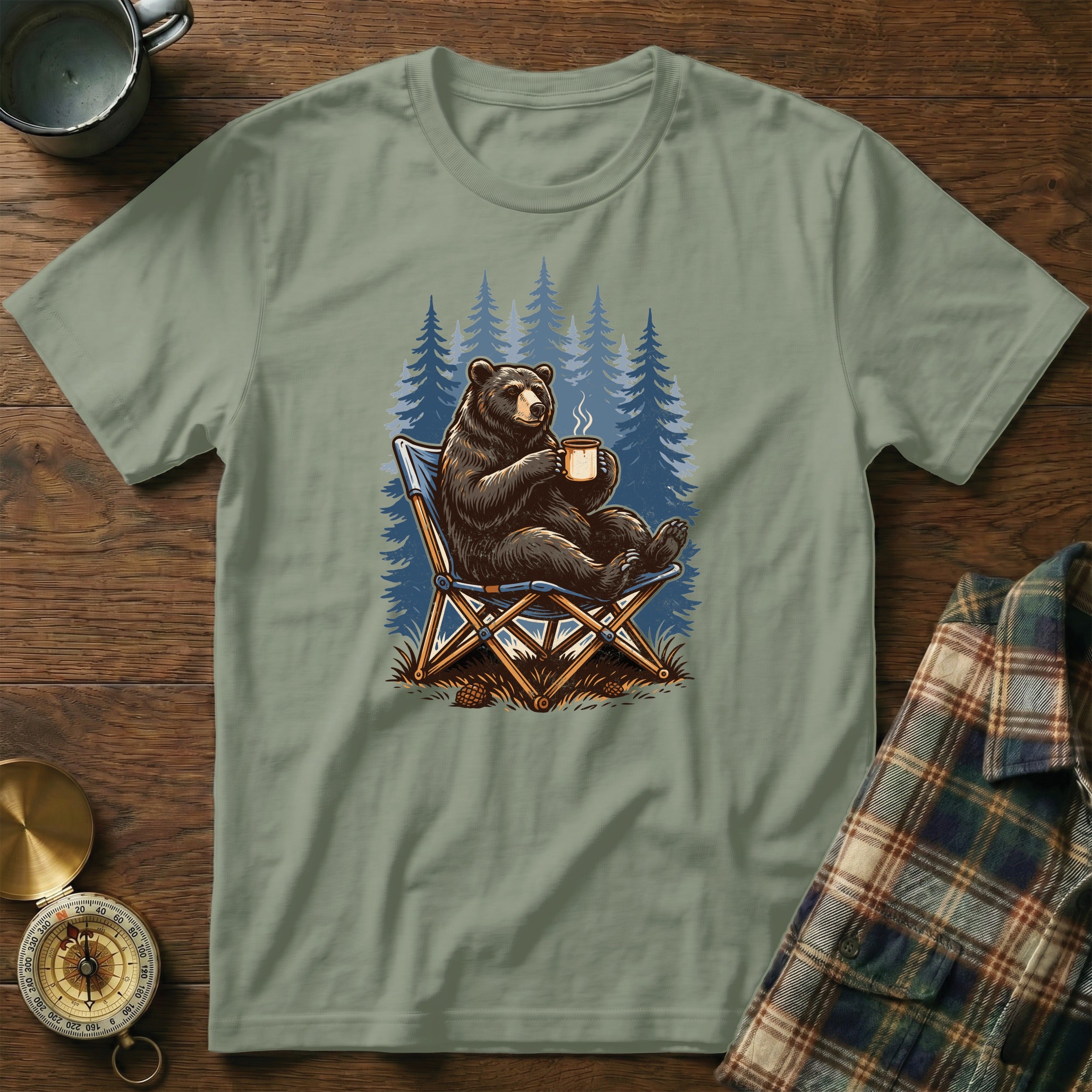 Bear in camping chair with coffee mug in front of pine trees illustration.