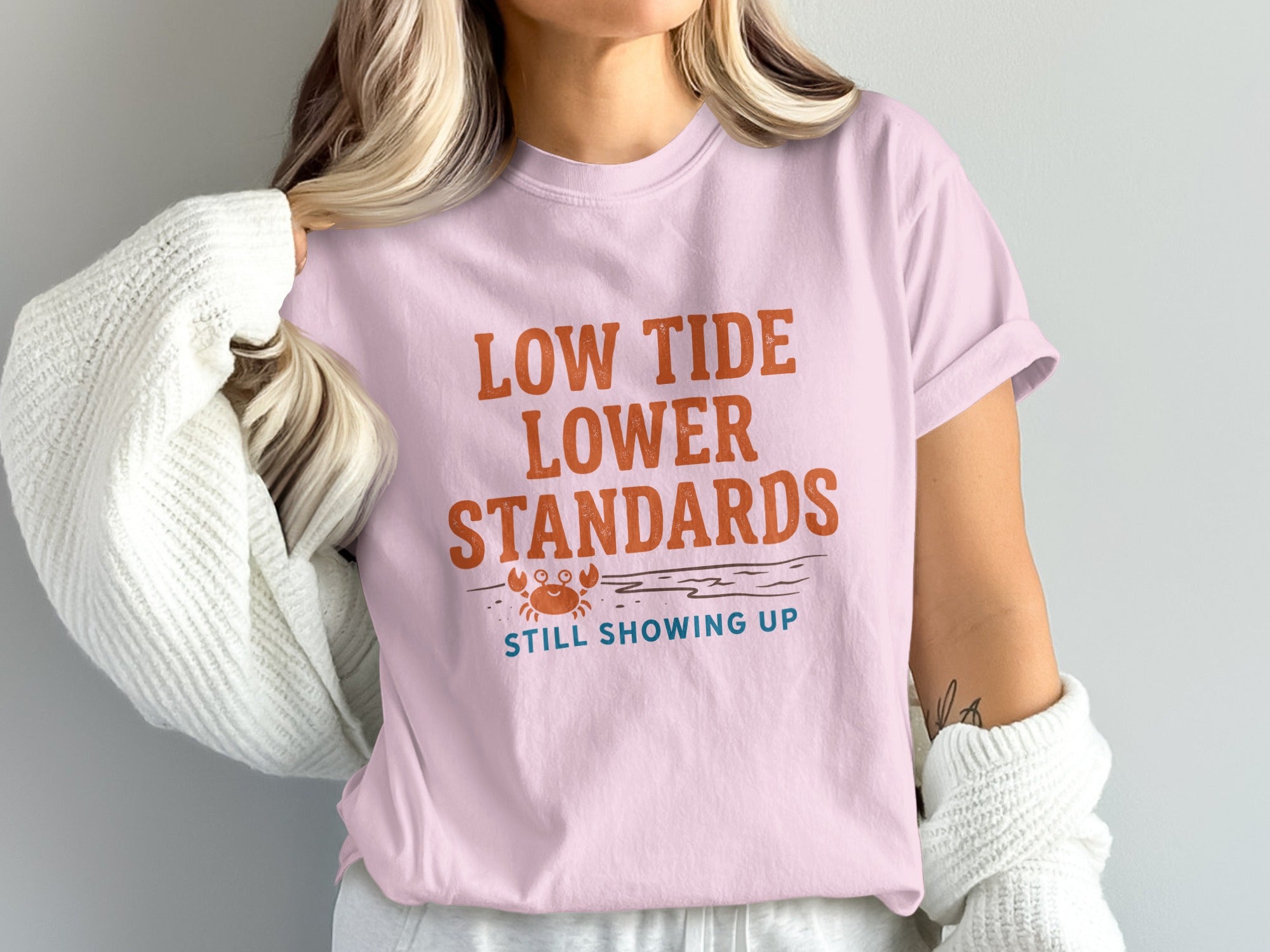 Pink t-shirt with "Low Tide Lower Standards" and a crab graphic.