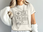 T-shirt with six postage stamp-style illustrations of nautical themes.