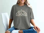 Gray t-shirt with a mountain and pine tree outline graphic on the front.