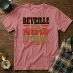 Dusty rose t-shirt featuring the black, brown, and gold text REVILLE IS NOW OPTIONAL EFFECTIVE IMMEDIATELY.