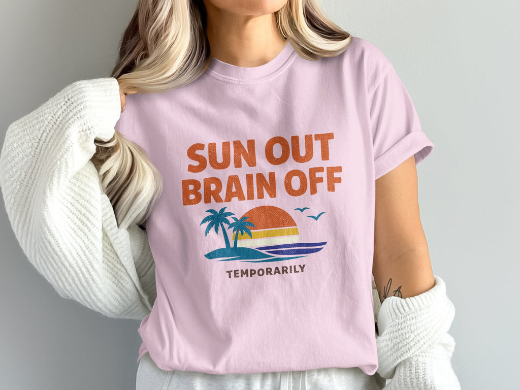 Pink t-shirt with "SUN OUT BRAIN OFF TEMPORARILY" and a beach sunset graphic.