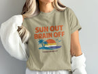 T-shirt with "Sun Out Brain Off" text, palm trees, and sunset over water.