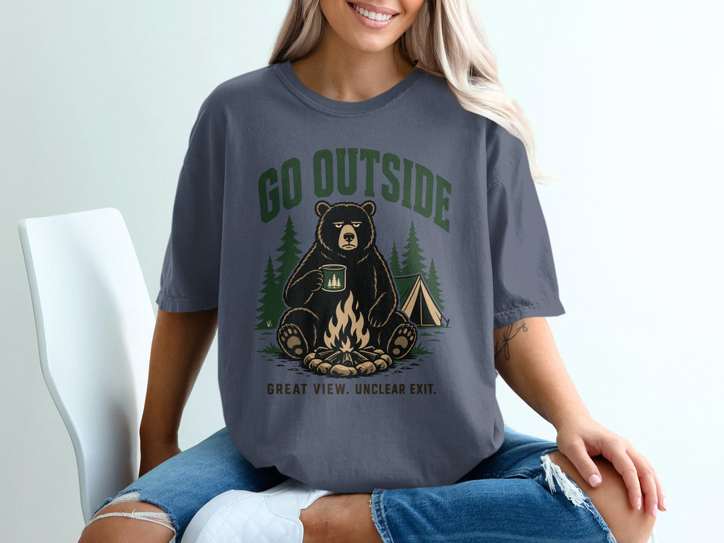 Graphic t-shirt with bear by campfire and tent, reads "GO OUTSIDE GREAT VIEW. UNCLEAR EXIT."