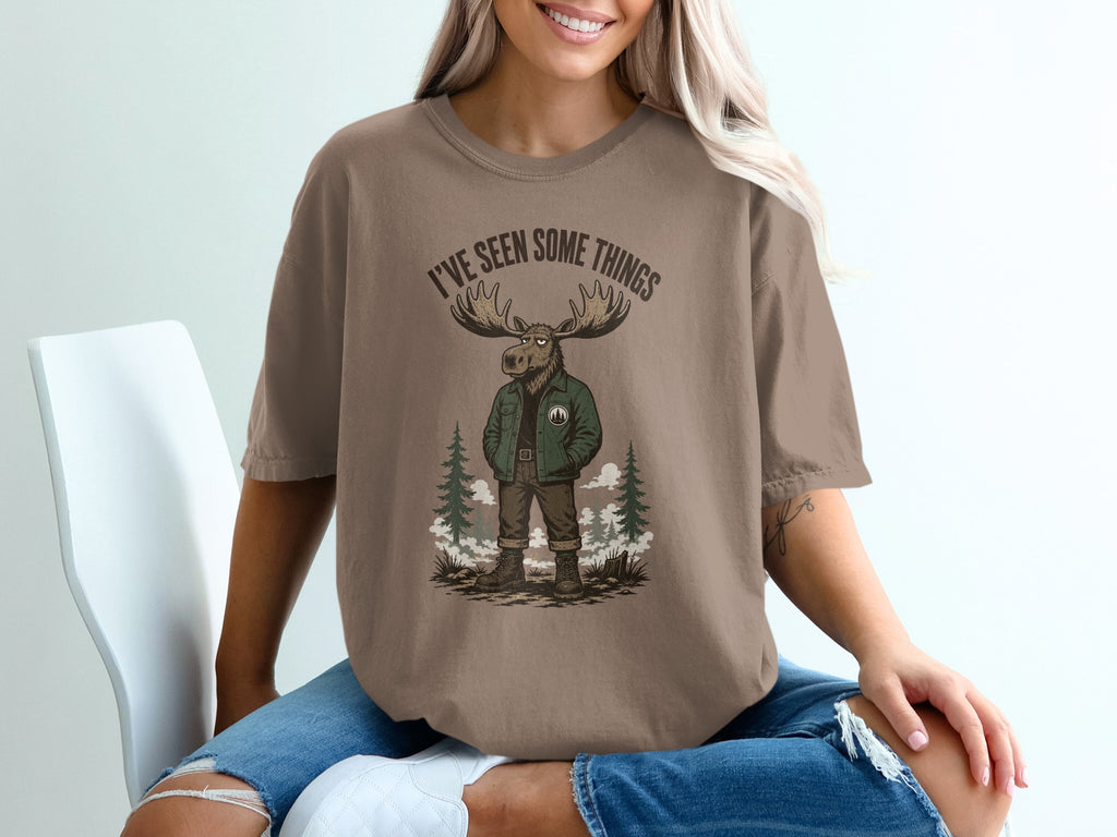 Brown t-shirt with graphic of a moose in jacket and text "I'VE SEEN SOME THINGS".