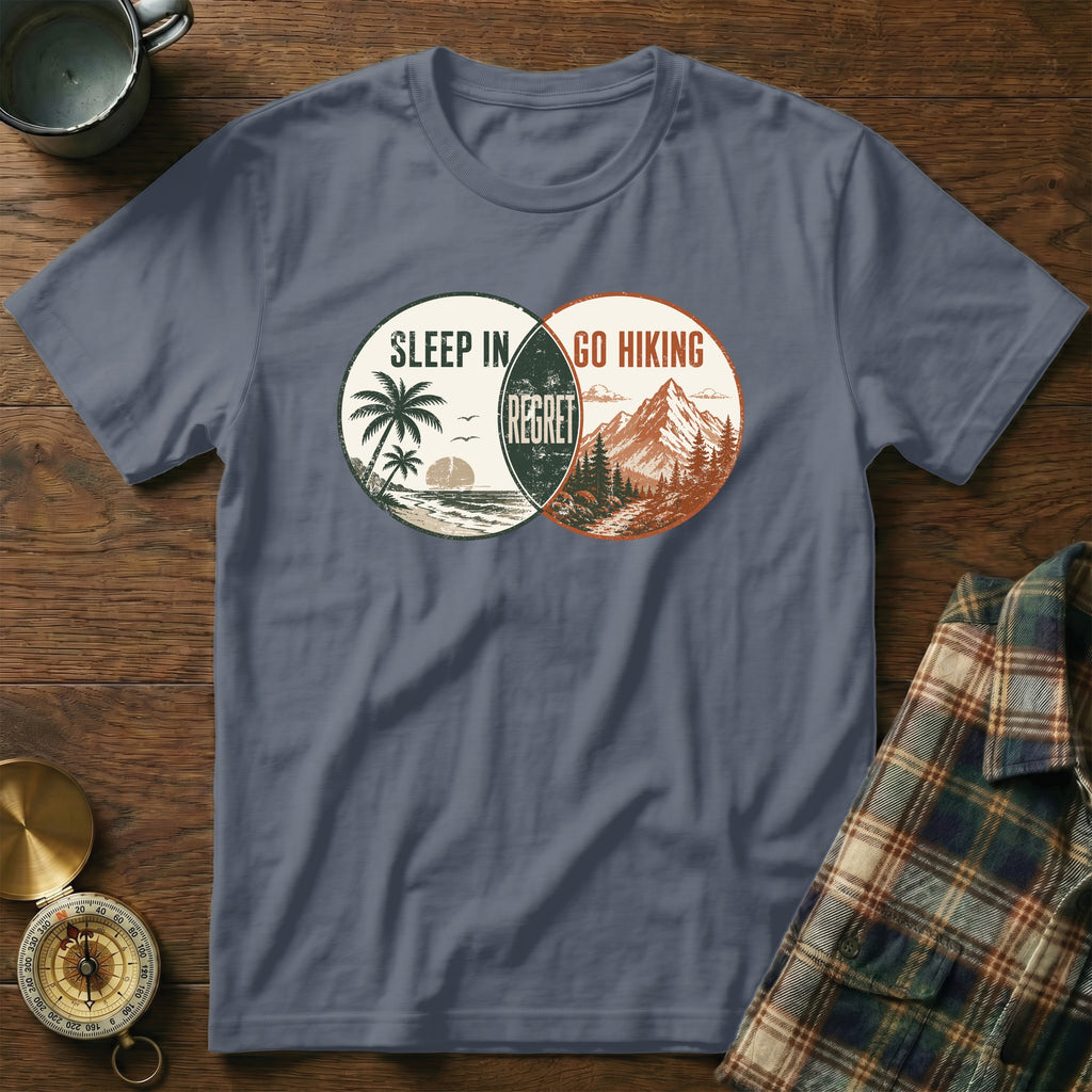 Sleep in or go hiking regret t-shirt graphic with beach and mountain scenes.