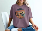 T-shirt with desert mountain sunset graphic.