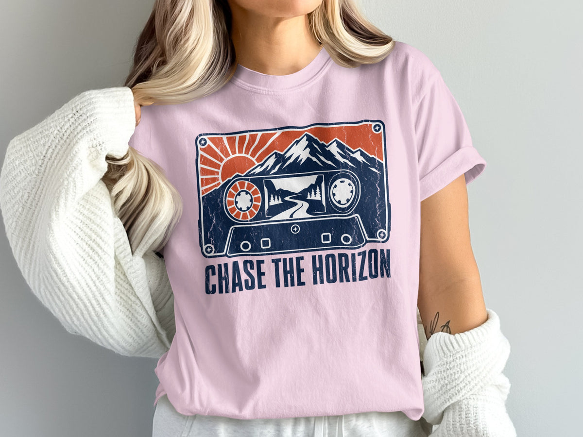 Pink t-shirt with cassette tape graphic and text "CHASE THE HORIZON".