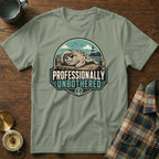 T-shirt graphic of a seal wearing sunglasses on a pier with lighthouse and text "PROFESSIONALLY UNBOTHERED."
