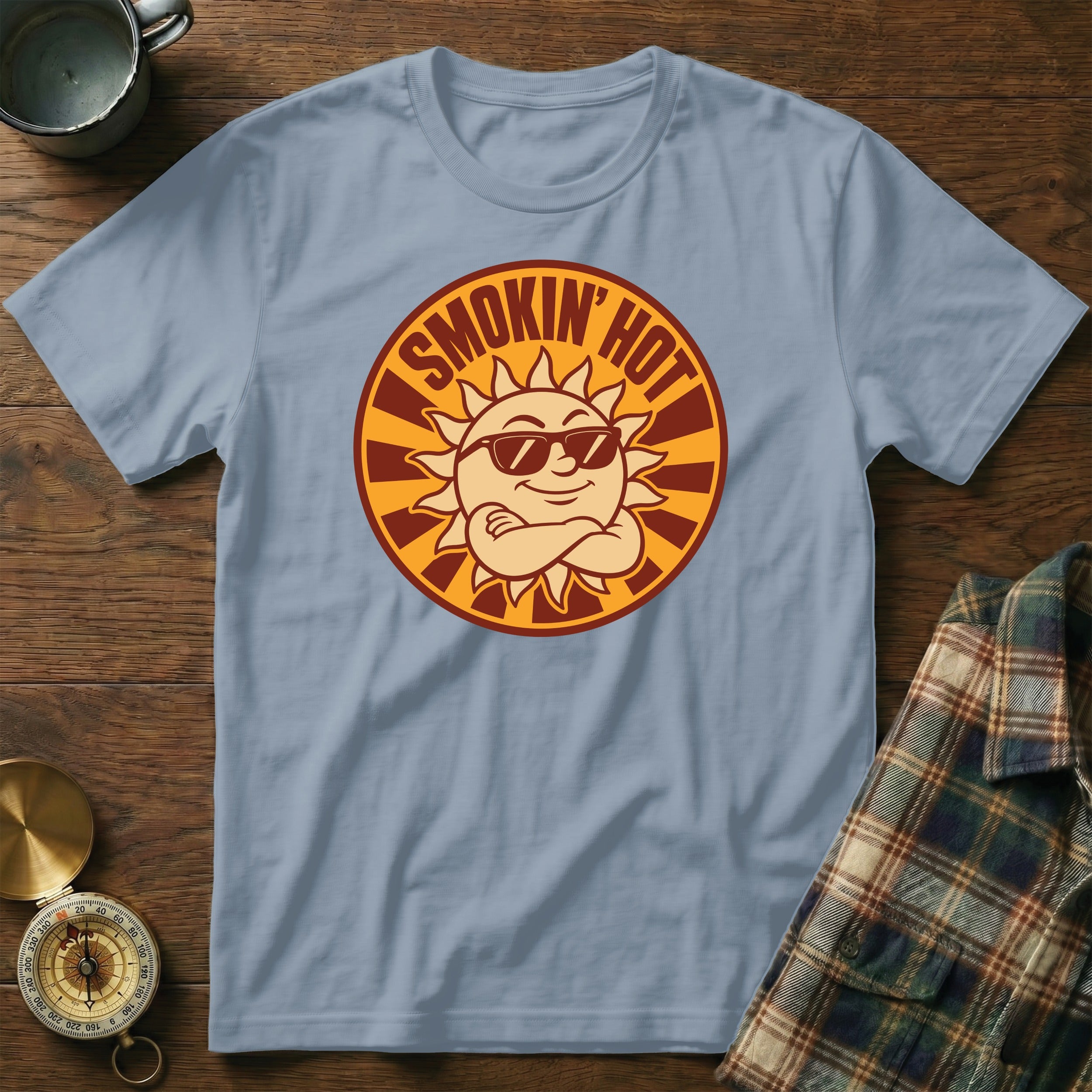 Light blue t-shirt with a sun graphic and text that reads "SMOKIN' HOT".