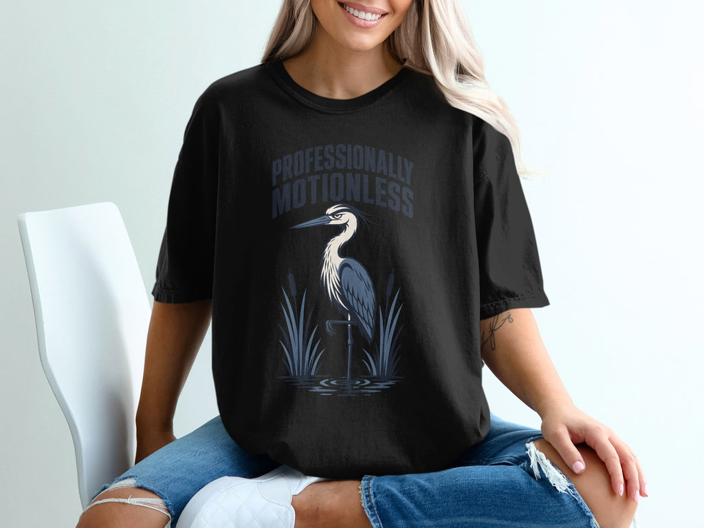 Black t-shirt with "Professionally Motionless" text and a heron graphic.