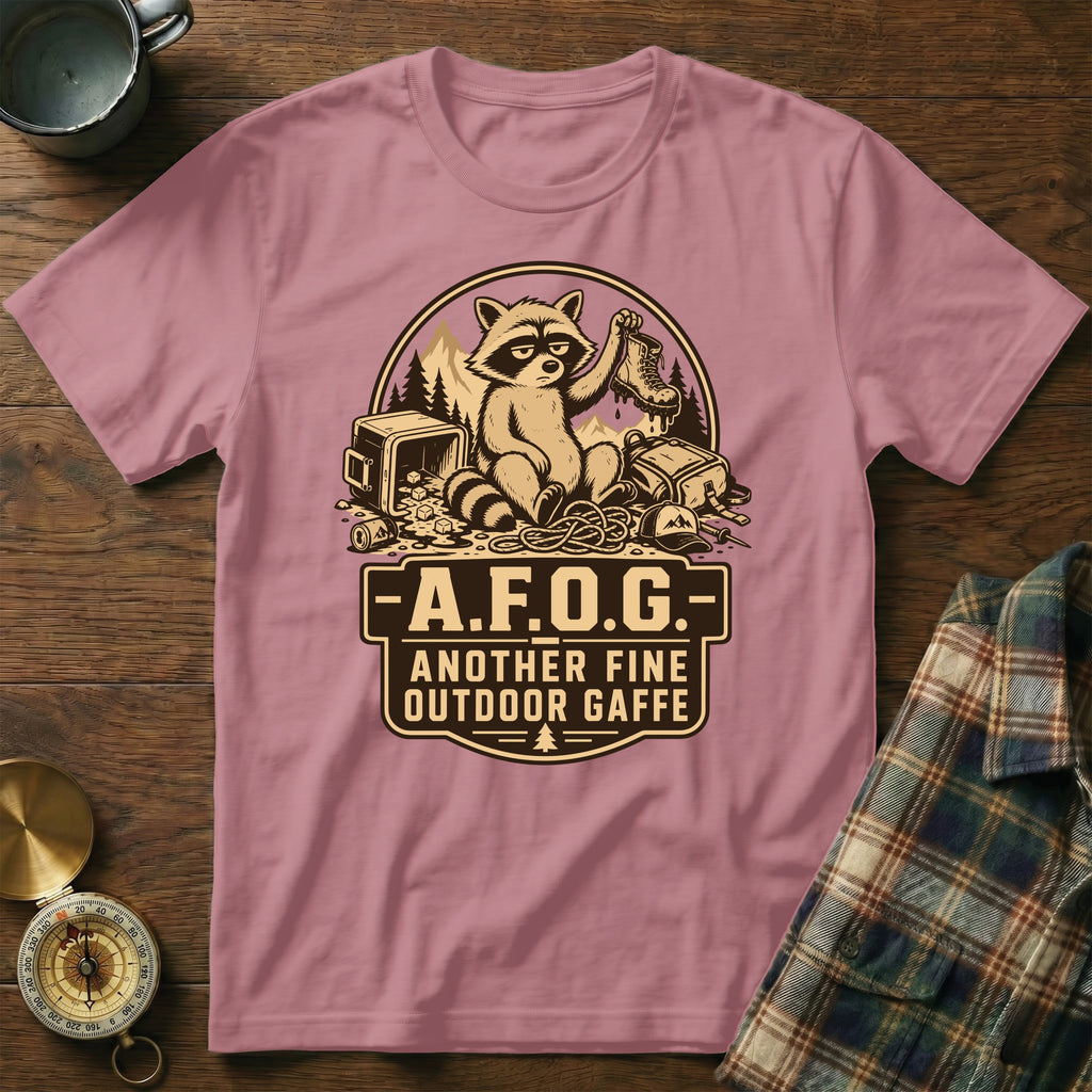 T-shirt graphic with raccoon holding boot, text "A.F.O.G. Another Fine Outdoor Gaffe".