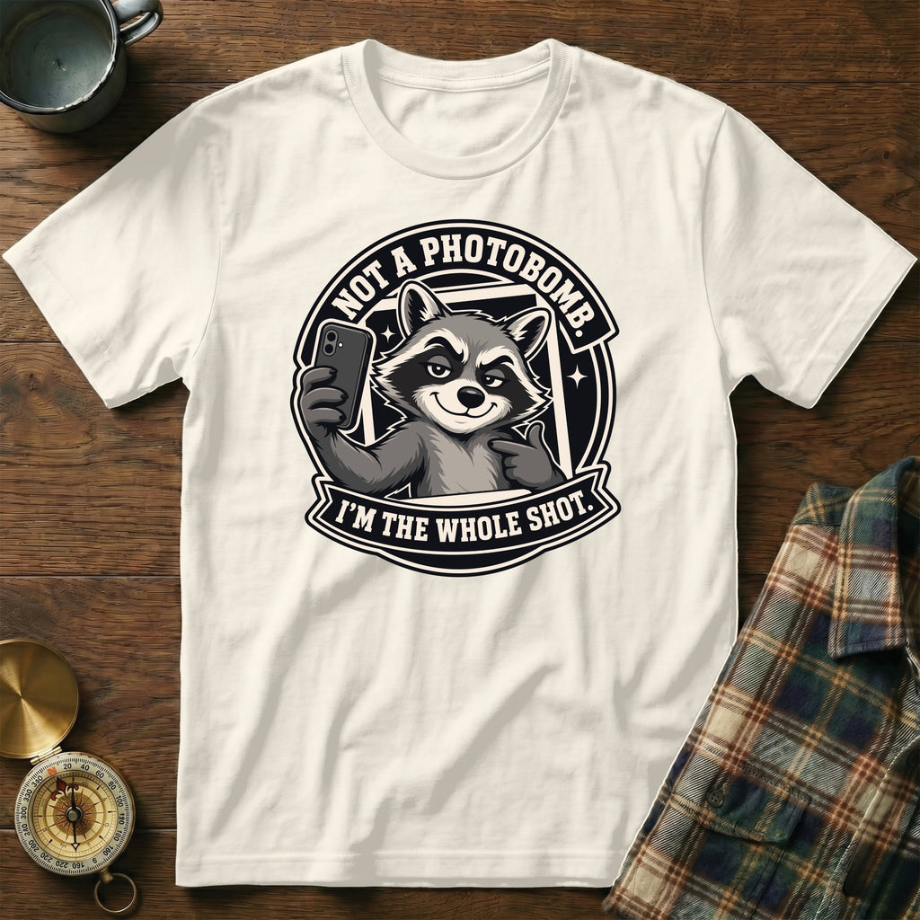 White t-shirt with raccoon graphic saying "Not a photobomb. I'm the whole shot."