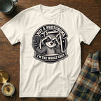 White t-shirt with raccoon graphic saying "Not a photobomb. I'm the whole shot."
