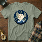 Green t-shirt with a circular design of a moon, mountains, and trees.