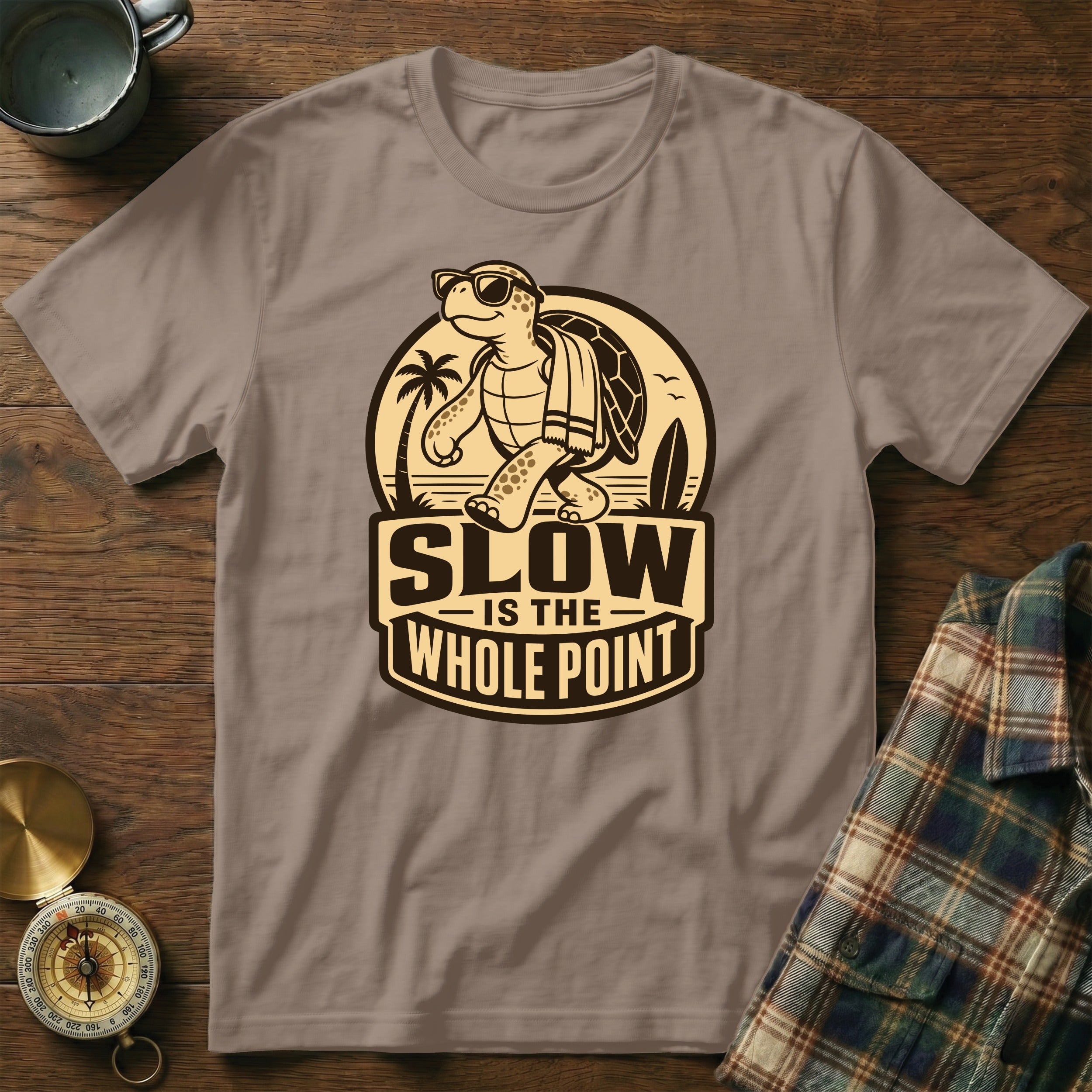 T-shirt with cartoon turtle, surfboard, palm trees, and text "SLOW IS THE WHOLE POINT".