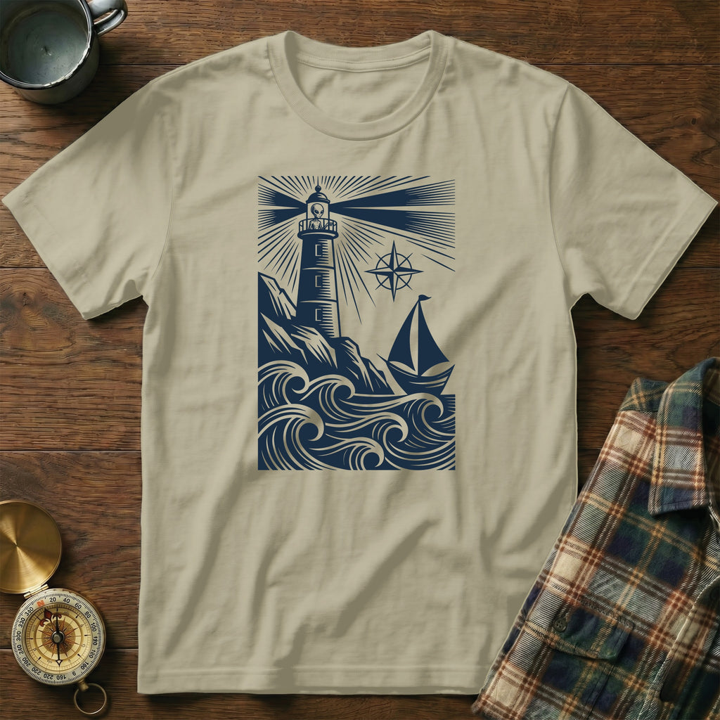T-shirt with a navy blue graphic of a lighthouse, waves, and sailboat.