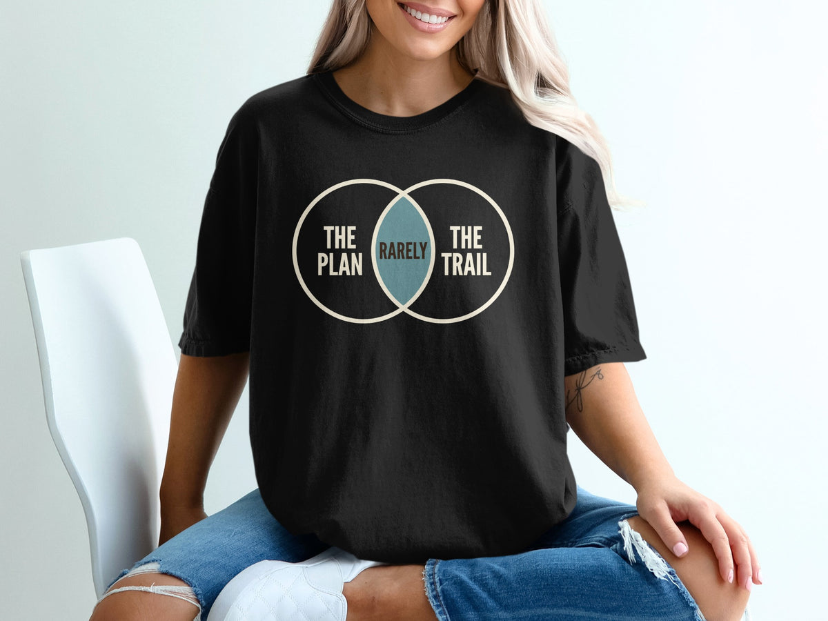 Black t-shirt with Venn diagram graphic: "The Plan," "Rarely," "The Trail."