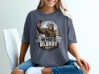 Bigfoot taking a selfie in snowy mountains with text "WHO'S BLURRY NOW?".