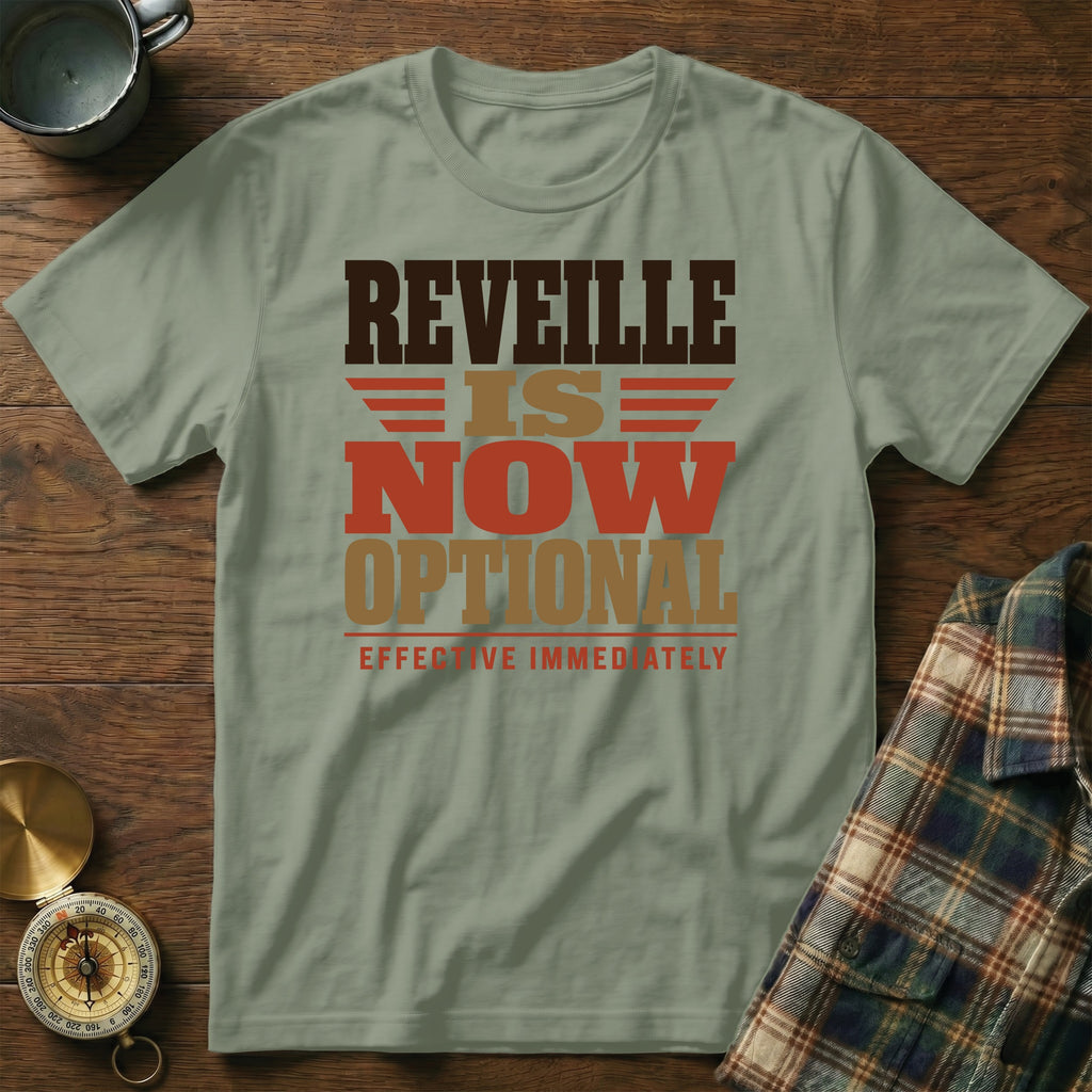 Sage green t-shirt with brown and orange text reading REVEILLE IS NOW OPTIONAL.