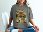 Groundhog holding nuts with text "Hoarding Snacks Since Birth".