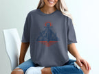 Anchor and mountain graphic with sunrise reflection on a dark blue t-shirt.