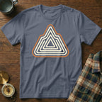 Slate blue t-shirt with geometric mountain logo on wooden background