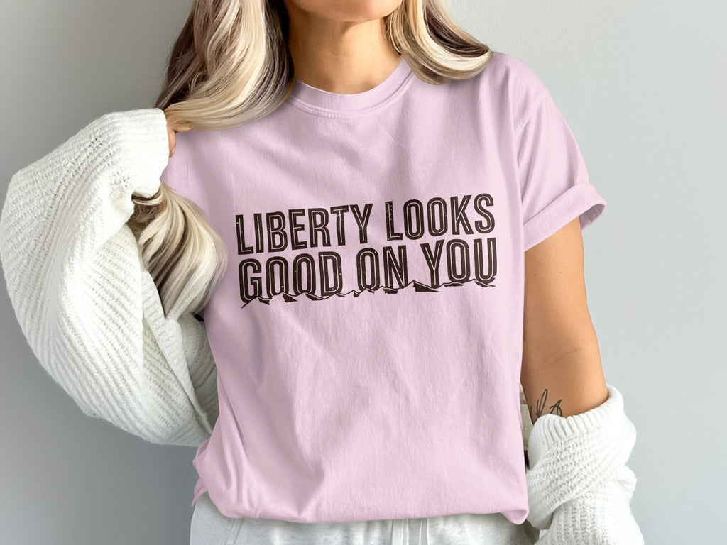 Pink t-shirt with "Liberty Looks Good On You" text.