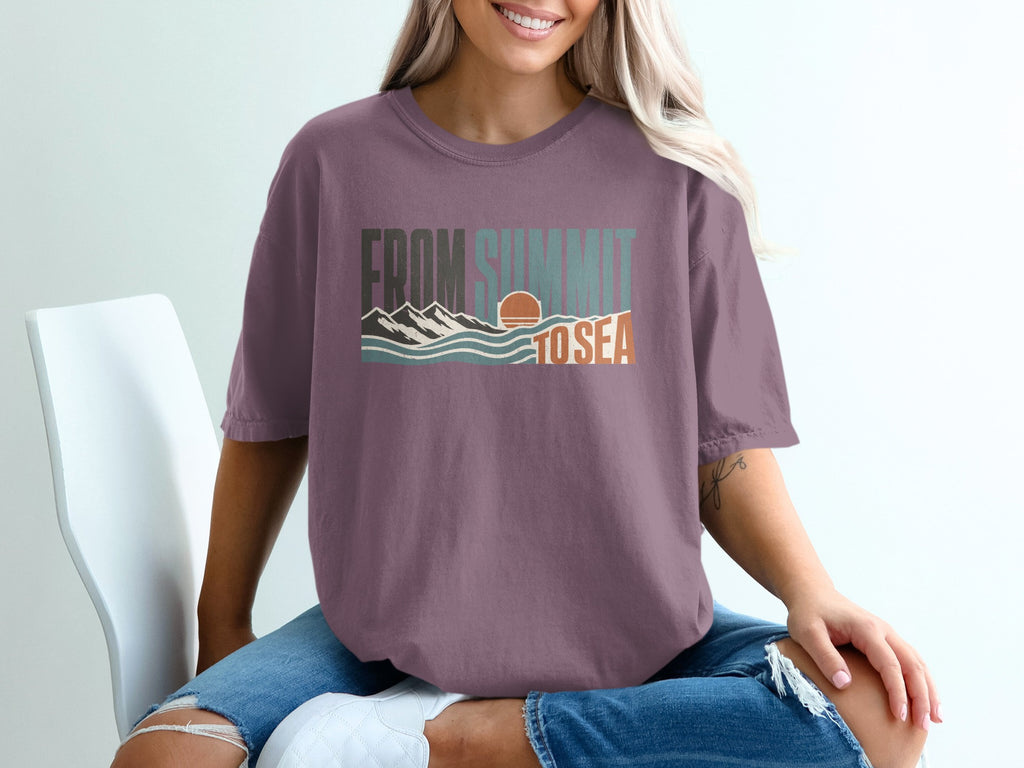 Purple t-shirt with "FROM SUMMIT TO SEA" text and mountain and ocean graphic.