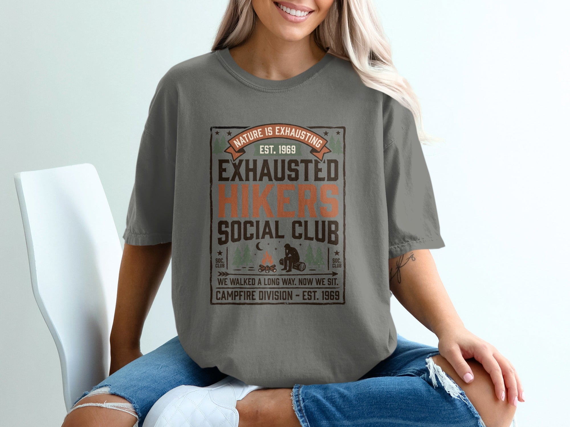Grey t-shirt with "Nature is Exhausting" and "Exhausted Social Club" text.