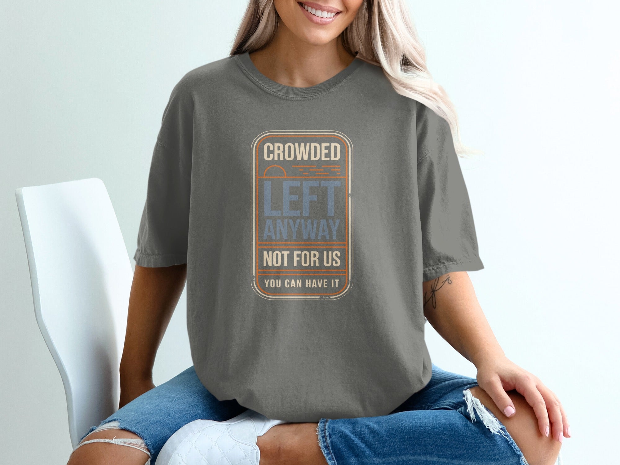 Grey t-shirt with "Crowded Left Anyway You Can Have It" graphic.