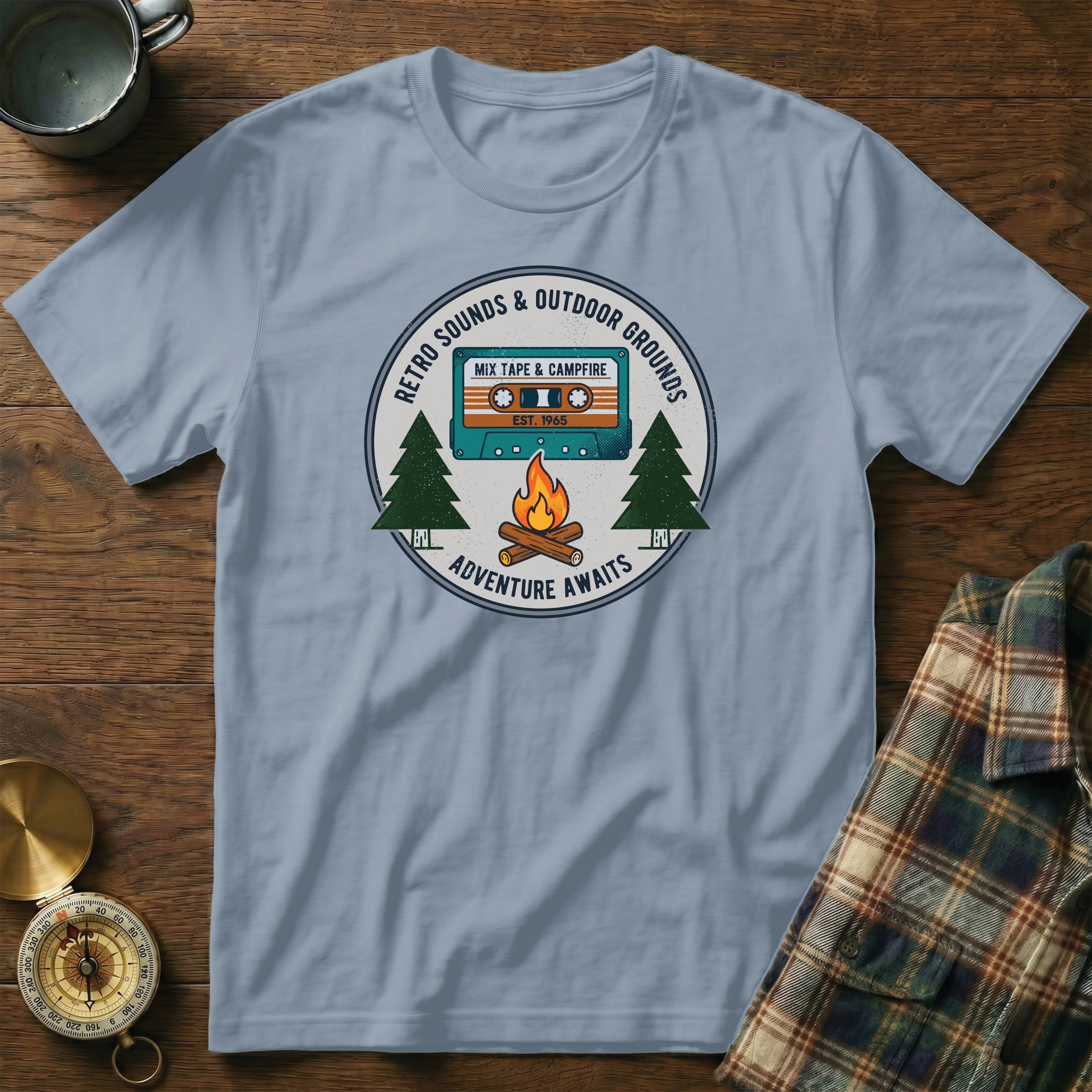 T-shirt graphic with cassette, campfire, trees, and text: "Retro Sounds & Outdoor Grounds".