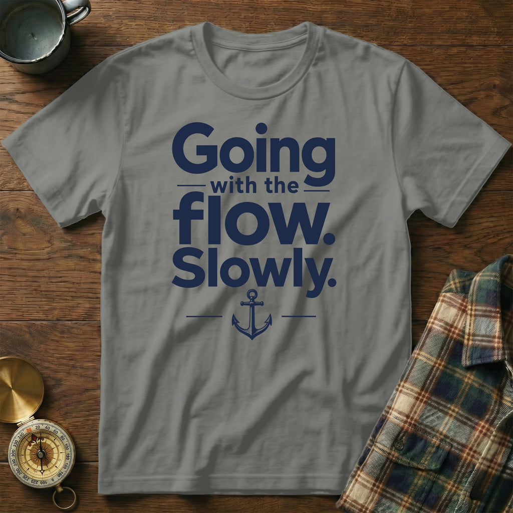 Gray t-shirt featuring blue text reading Going with the flow. Slowly. and a small anchor graphic.