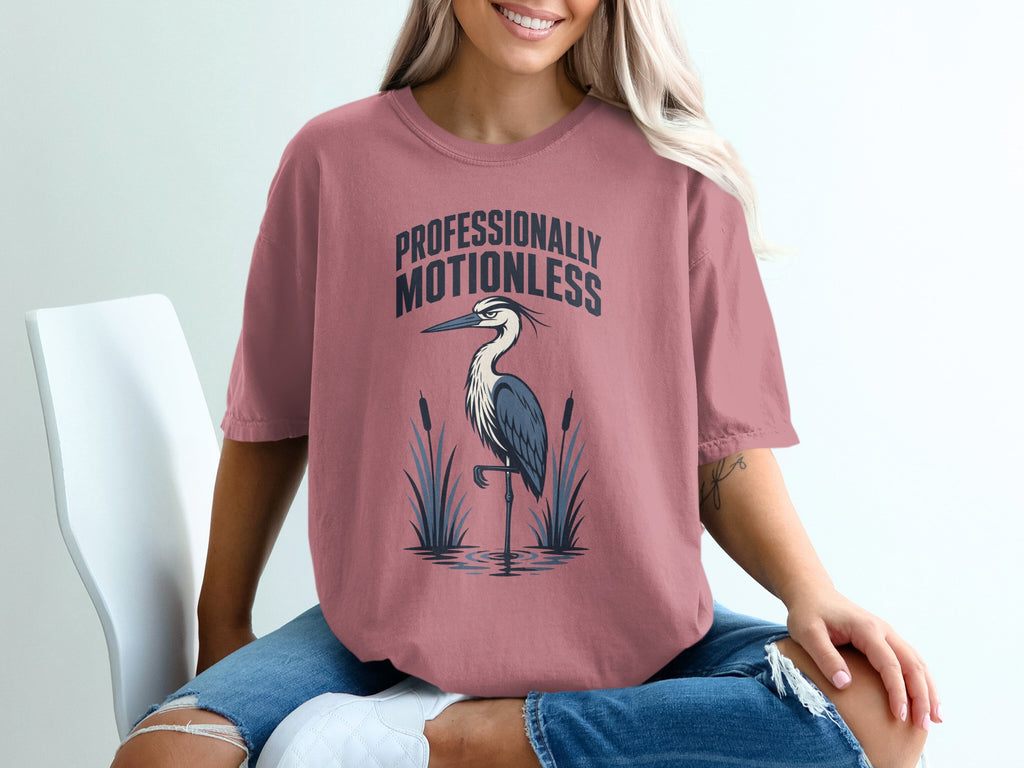 T-shirt with a heron and the text "PROFESSIONALLY MOTIONLESS."
