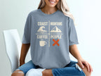 Shirt with "Coast Mountains Coffee People" graphic featuring wave, mountain, coffee cup, and X icons.