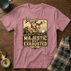 Pink t-shirt with "Majestic but Exhausted" text and cartoon elk design.