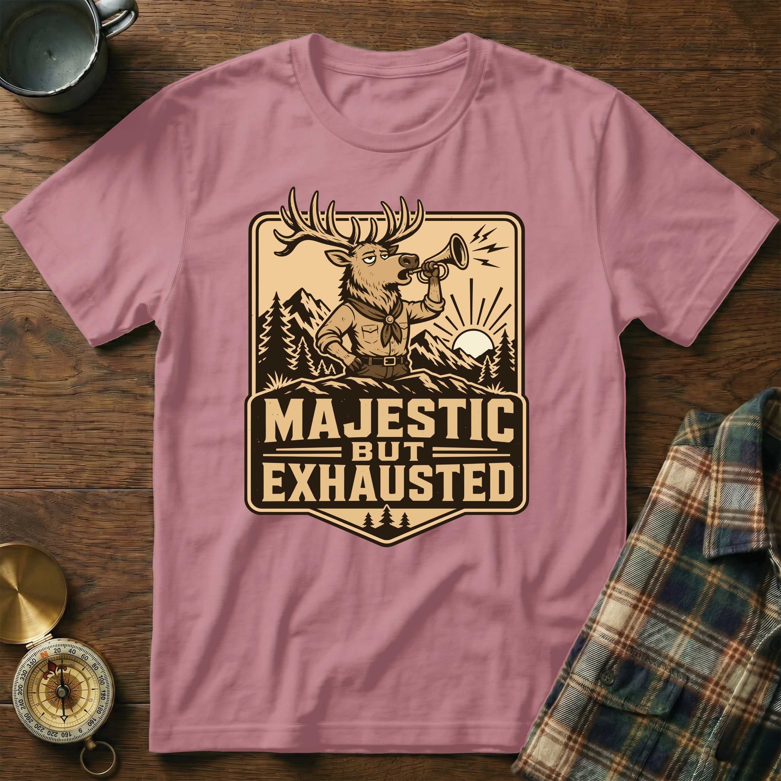 Pink t-shirt with "Majestic but Exhausted" text and cartoon elk design.