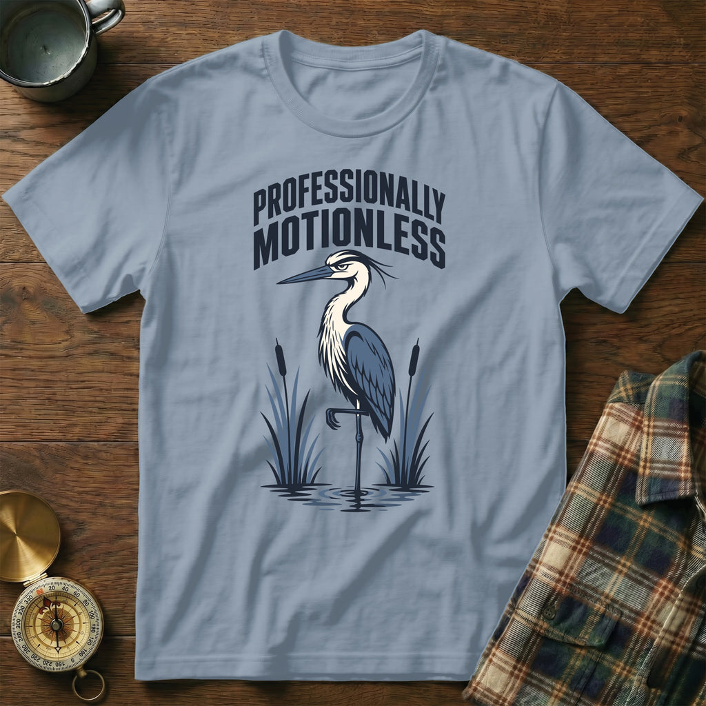Light blue t-shirt with a heron and "PROFESSIONALLY MOTIONLESS" text.